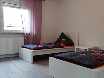 Monteurwohnung - Küche: eigene Küche - Schlafzimmer im 1. Obergeschoss - sleep in Bremen